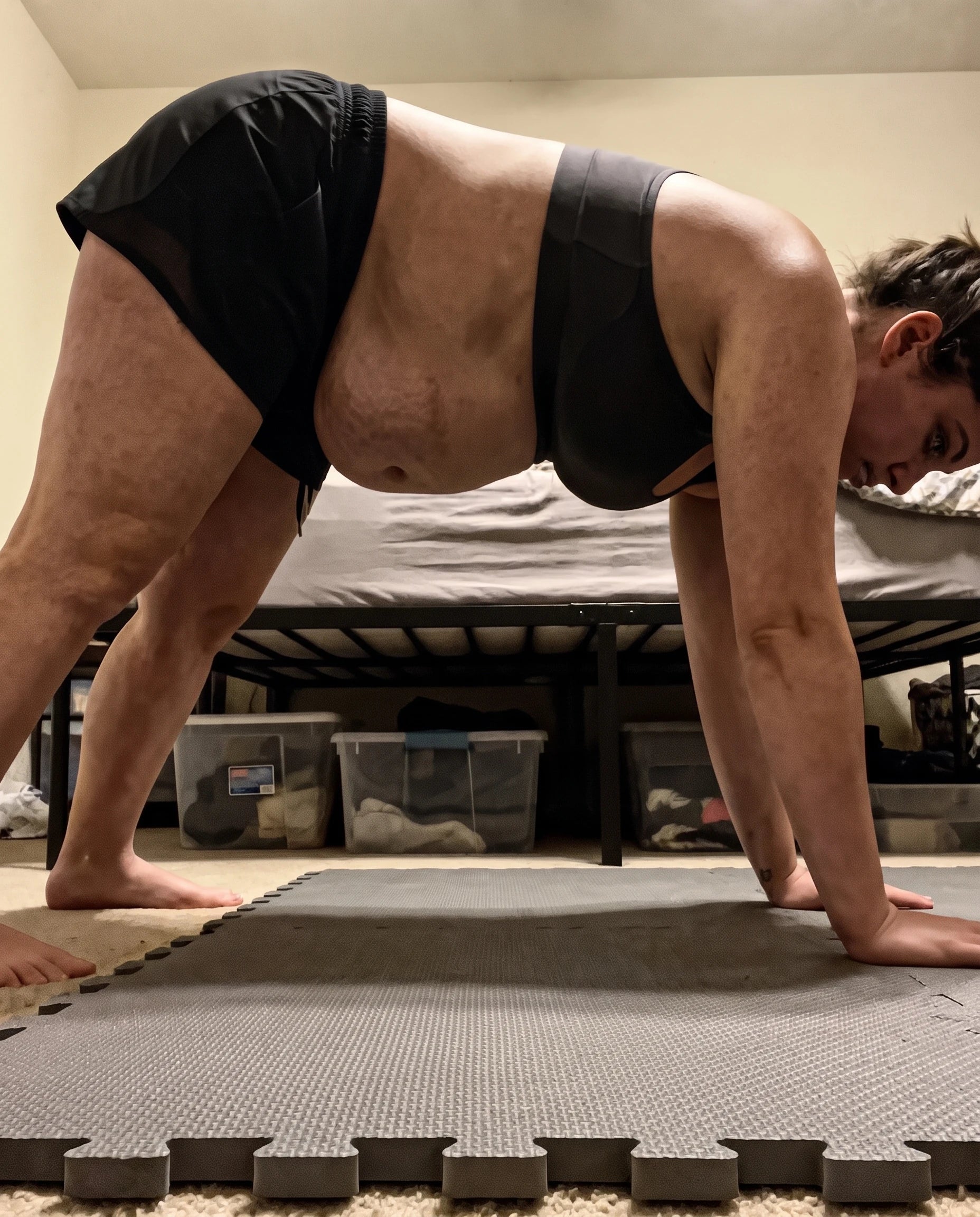 Woman holding a plank on an exercise mat